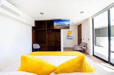 Cama o camas de una habitación en KUKO SUITES