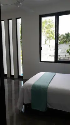 Cama o camas de una habitación en Casa Chikatana un lugar familiar y elegante a pasos de la playa Bacocho