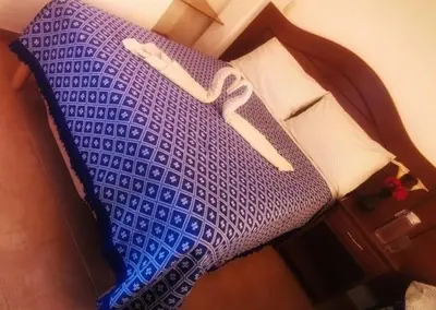 Cama o camas de una habitación en hotel posada los dominicos