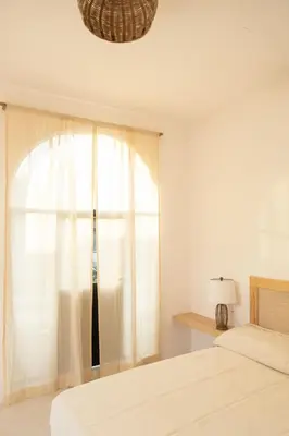 Cama o camas de una habitación en La Punta Rooms