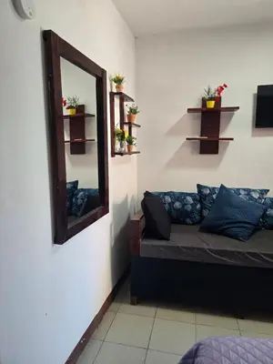 Zona de estar de Habitación 2 climatizada cerca de IMSS UMAE
