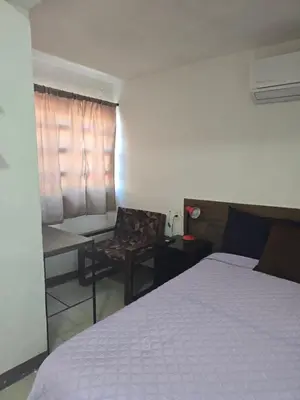 Cama o camas de una habitación en Habitación 2 climatizada cerca de IMSS UMAE