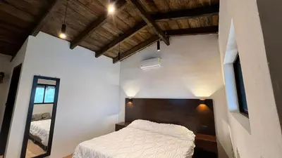 Cama o camas de una habitación en La Peña Hotel Boutique & SPA