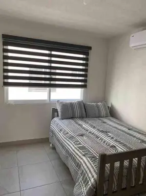 Cama o camas de una habitación en Hermoso Apartamento con club de playa