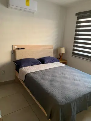Cama o camas de una habitación en Hermoso Apartamento con club de playa