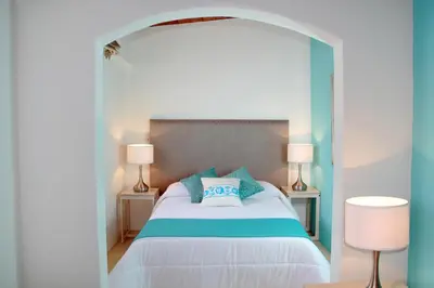 Cama o camas de una habitación en Hotel La Casa de María