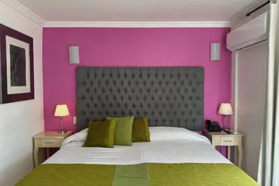 Cama o camas de una habitación en Hotel La Casa de María