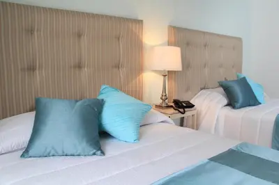 Cama o camas de una habitación en Hotel La Casa de María