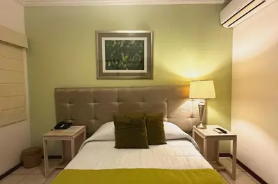 Cama o camas de una habitación en Hotel La Casa de María