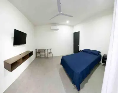 Una televisión o centro de entretenimiento en Habitación privada en Huatulco
