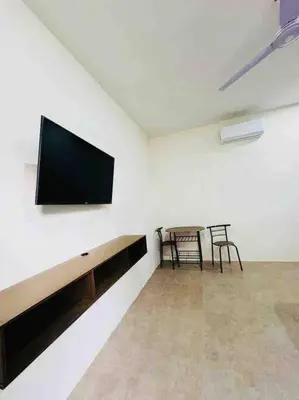 Una televisión o centro de entretenimiento en Habitación privada en Huatulco