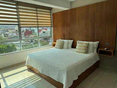 Cama o camas de una habitación en Hotel DABA