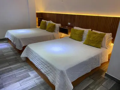 Cama o camas de una habitación en Hotel DABA