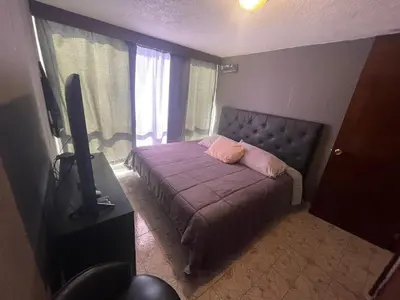 Cama o camas de una habitación en Habitación con baño compartido