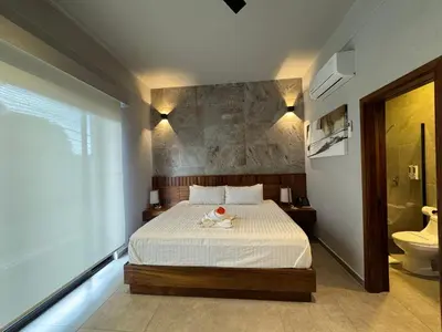 Cama o camas de una habitación en Aurora Hotel Boutique