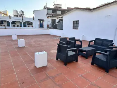 Zona de estar de Centrico House