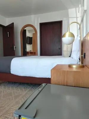 Cama o camas de una habitación en CHOLULA SUITES