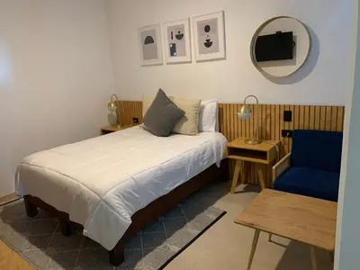 Cama o camas de una habitación en CHOLULA SUITES