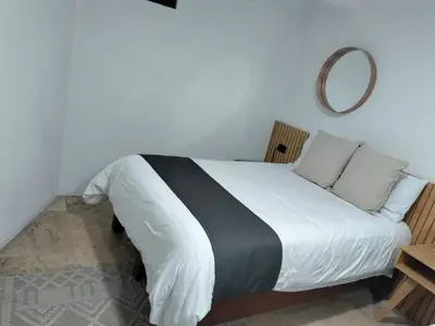 Cama o camas de una habitación en CHOLULA SUITES