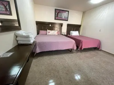 Cama o camas de una habitación en HOTEL OTOMI