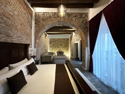 Cama o camas de una habitación en HOTEL BOUTIQUE CASONA 65