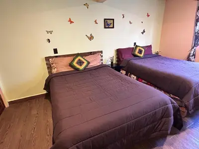 Cama o camas de una habitación en Mariposas