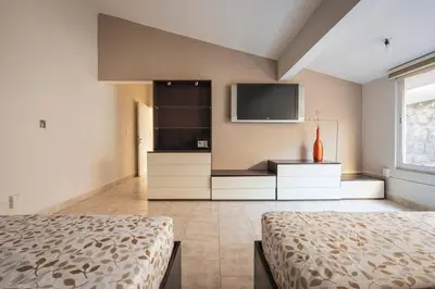 Una televisión o centro de entretenimiento en Exclusiva Residencia de Lujo con Alberca Privada