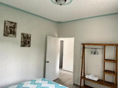 Cama o camas de una habitación en Departamento cómodo y céntrico en Malinalco.