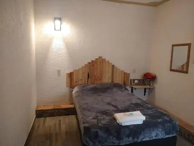 Cama o camas de una habitación en Departamento cómodo y céntrico en Malinalco.
