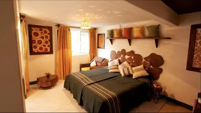 Cama o camas de una habitación en Con arte oaxaqueño a 15 min del centro