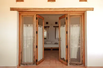 Cama o camas de una habitación en Casa de playa El Cortijo