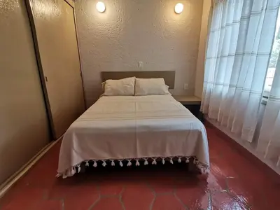 Cama o camas de una habitación en Bungalow del trotamundos
