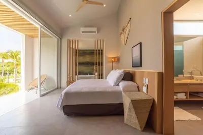 Cama o camas de una habitación en Casa Yoo tu oasis de lujo en Huatulco