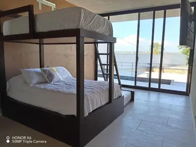 Cama o camas de una habitación en Quinta Guamuchil Acceso lago
