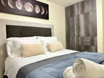 Cama o camas de una habitación en Apartamento cerca autódromo