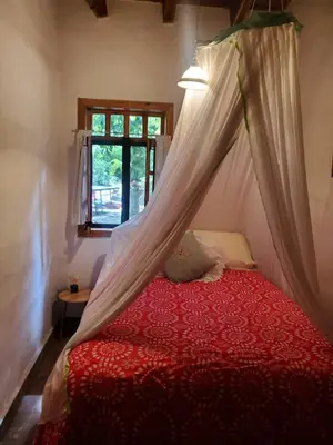 Cama o camas de una habitación en Glamping Teques Naturaleza de lujo Granja El Sol