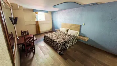 Cama o camas de una habitación en Hotel Plaza San Juan