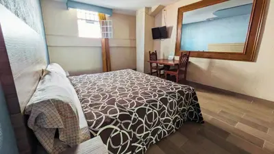Cama o camas de una habitación en Hotel Plaza San Juan