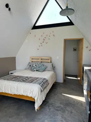 Cama o camas de una habitación en Chalets Encino Saúco