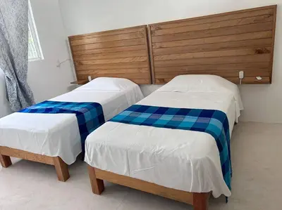 Cama o camas de una habitación en Casa Maya, tu escape con alberca privada