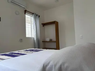 Cama o camas de una habitación en Casa Maya, tu escape con alberca privada