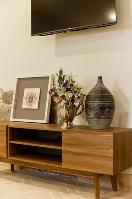 Una televisión o centro de entretenimiento en Casa Nduxi Puebla Departamentos