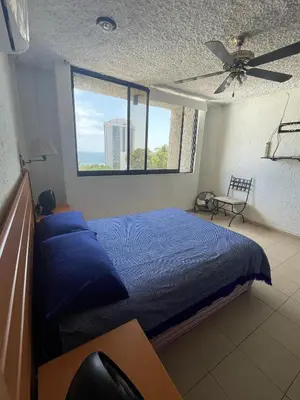 Cama o camas de una habitación en Costera, depa hasta 9 personas con vista al mar, alberca, terraza y aire acondicionado