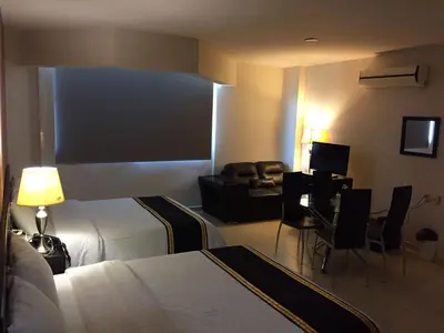 Cama o camas de una habitación en Hotel & Lounge Las Islas