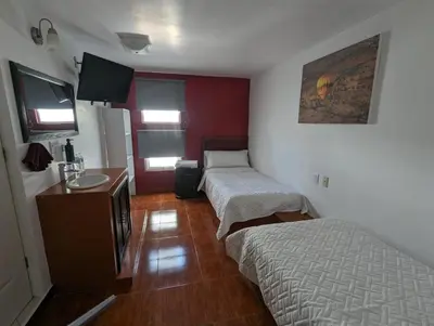 Cama o camas de una habitación en Hotel María Bonita