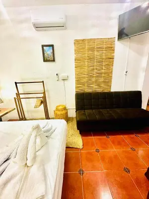 Cama o camas de una habitación en La Casa de Colores Ocean View