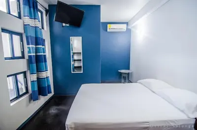 Cama o camas de una habitación en Hostal Azul y Blanco