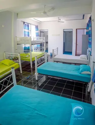 Cama o camas de una habitación en Hostal Azul y Blanco