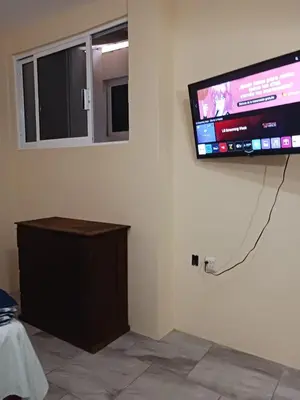Una televisión o centro de entretenimiento en POSADA del MAR