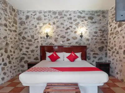 Cama o camas de una habitación en Rancho Hotel El Carmen